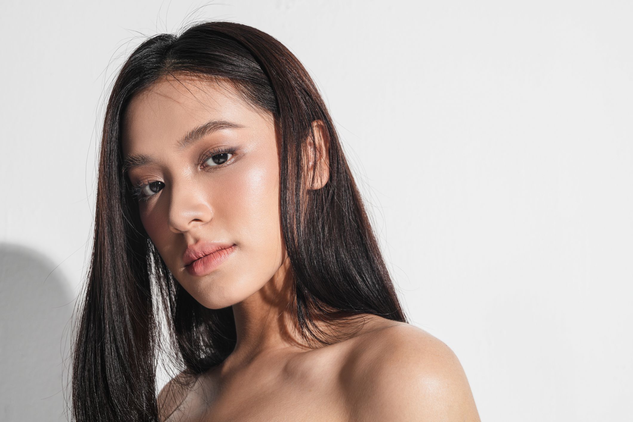 Portrait of a young woman with long hair.